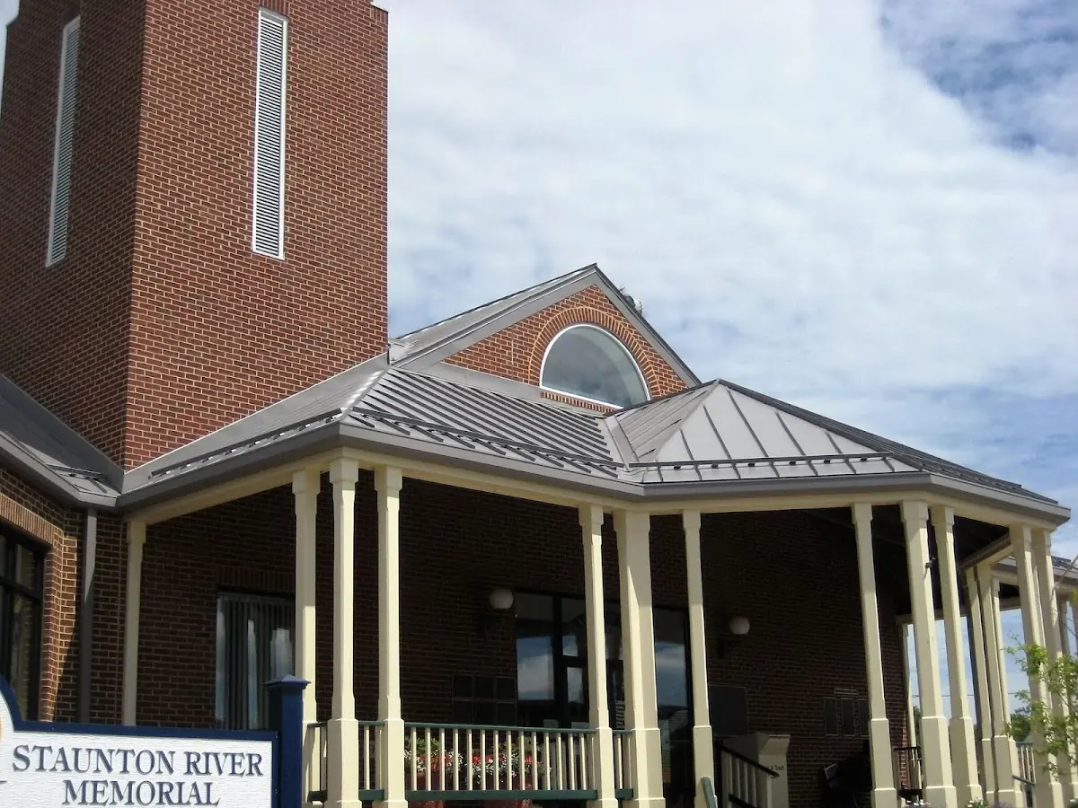 Skilled roofing craftsmen working on a residential roof in Rushville